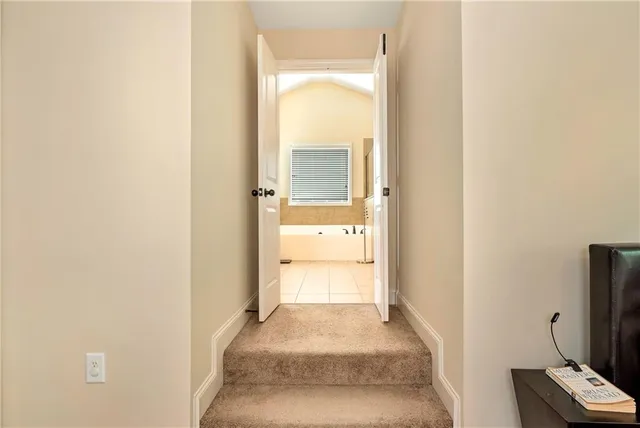a bedroom with furniture and a flat screen tv