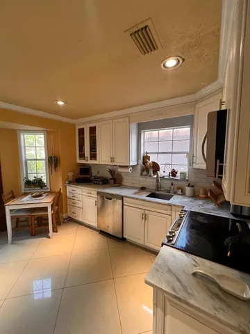 a bedroom with furniture and a wooden floor