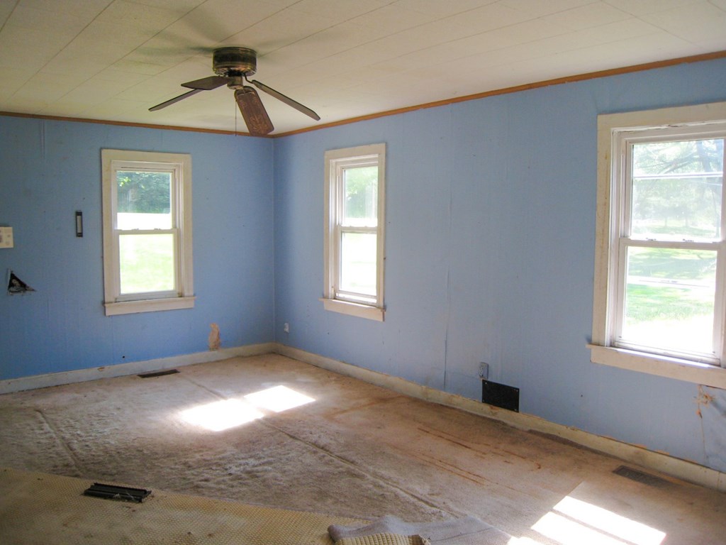 1665 Jackson Run Road Warren, PA 16365 - Photo 12 of 15 a view of a big room with windows and chandelier fan
