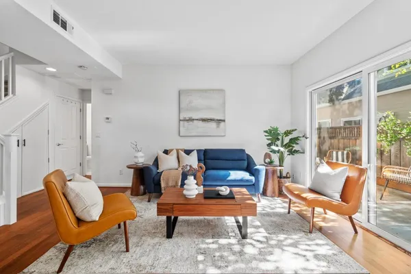 a living room with furniture and a rug