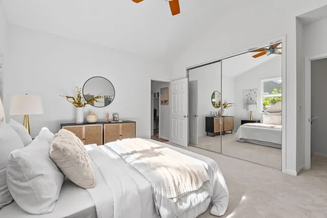 a bedroom with a bed and a couch