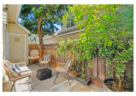 a view of two chairs in the balcony