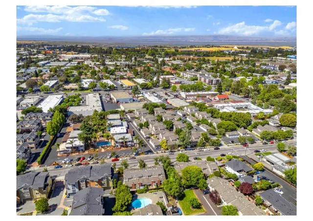 a picture of a wall with a white building