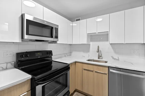 a kitchen with a stove and a microwave