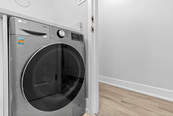 a utility room with washing machine
