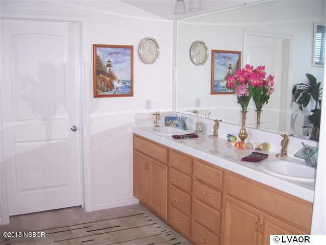 513 Andromeda Drive Lompoc, CA 93436 - Photo 11 of 15 a bathroom with a sink mirror and vanity