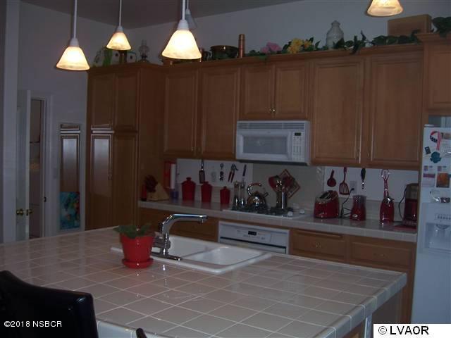 513 Andromeda Drive Lompoc, CA 93436 - Photo 12 of 15 a kitchen with stainless steel appliances granite countertop a refrigerator and a stove