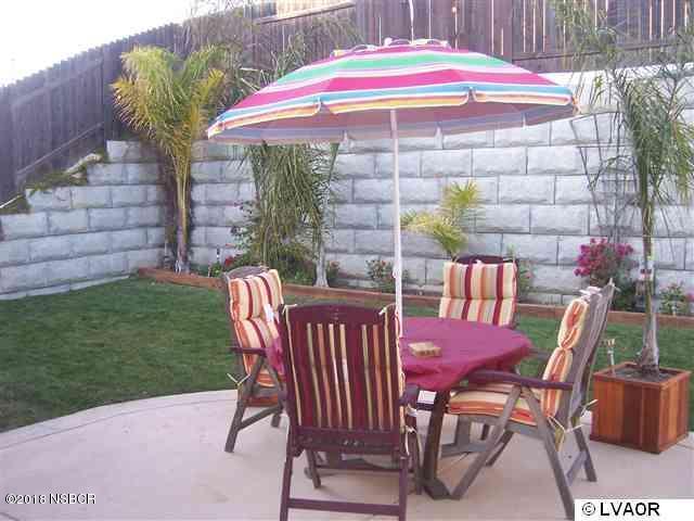 513 Andromeda Drive Lompoc, CA 93436 - Photo 7 of 15 a patio with table and chairs
