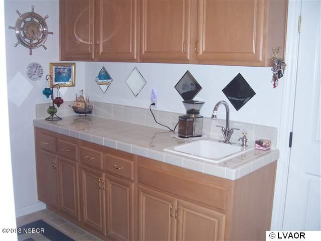 513 Andromeda Drive Lompoc, CA 93436 - Photo 9 of 15 a kitchen with cabinets appliances and a sink