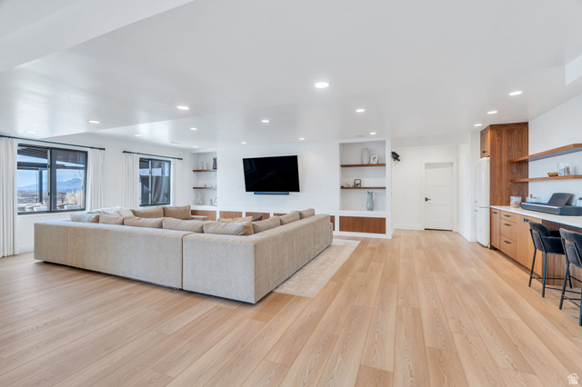 3918 South Mapleton Ests Drive Mapleton, UT 84664 - Photo 62 of 103 Living area with light wood finished floors, recessed lighting, and built in study area