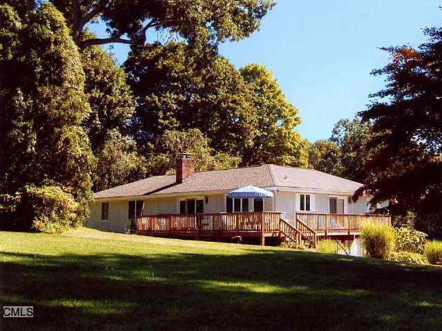 3 Sasqua Road Norwalk, CT 06855 - Photo 1 of 1 a front view of a house with a garden