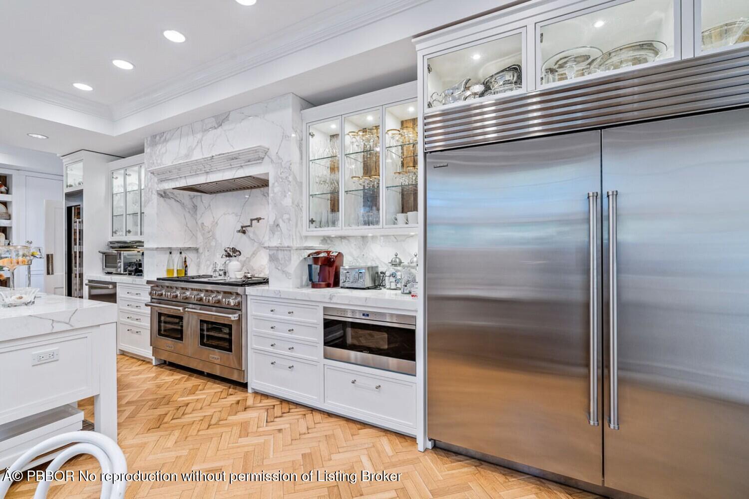 111 Via Del Lago Palm Beach, FL 33480 - Photo 36 of 72 a kitchen with stainless steel appliances cabinets and a counter top space