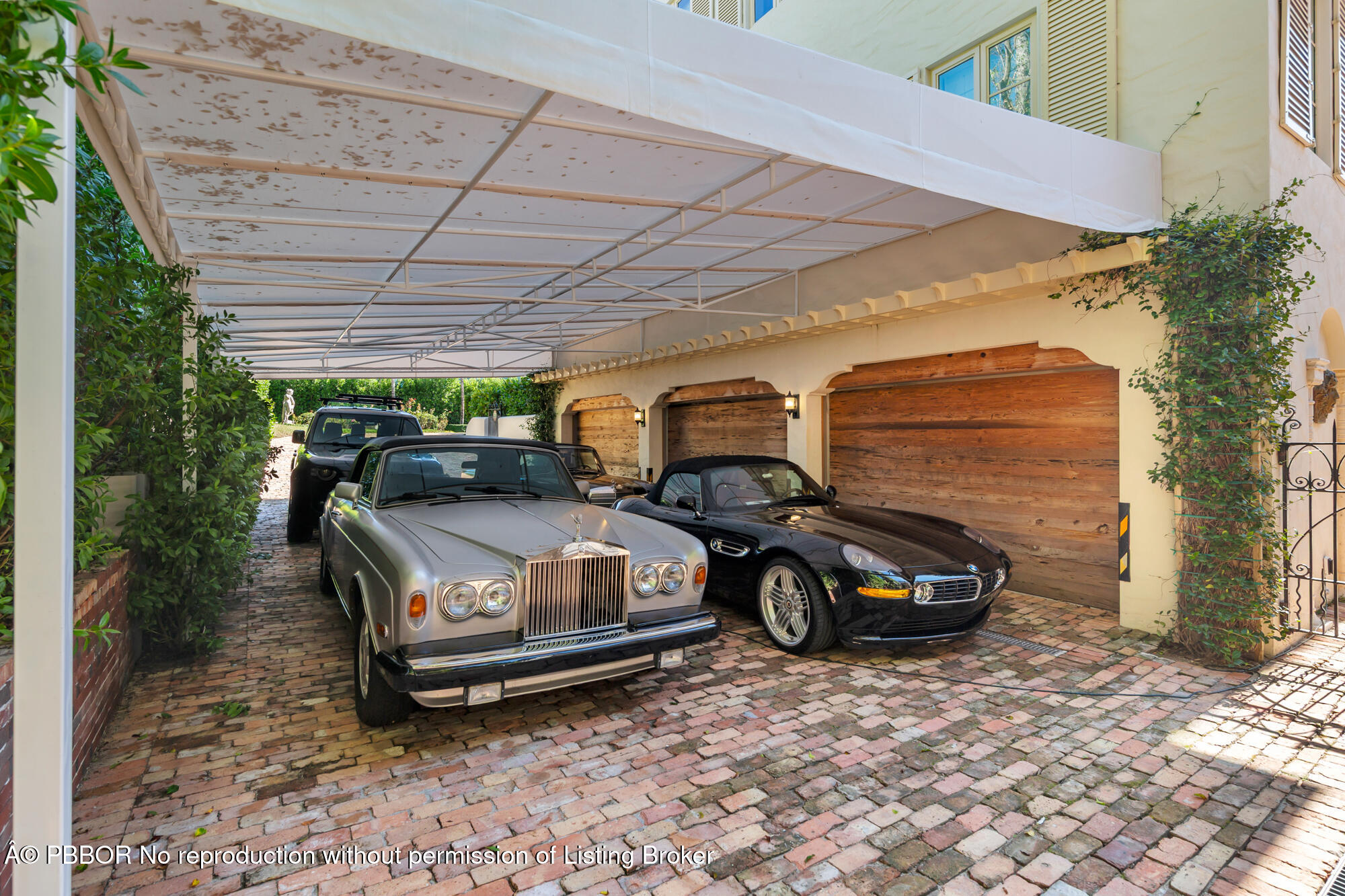 111 Via Del Lago Palm Beach, FL 33480 - Photo 52 of 72 a car parked in front of a house