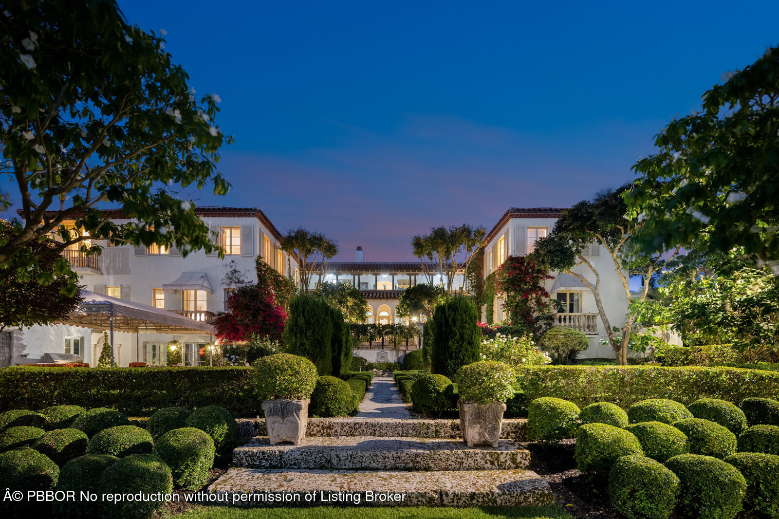 111 Via Del Lago Palm Beach, FL 33480 - Photo 9 of 72 a front view of a house with a yard