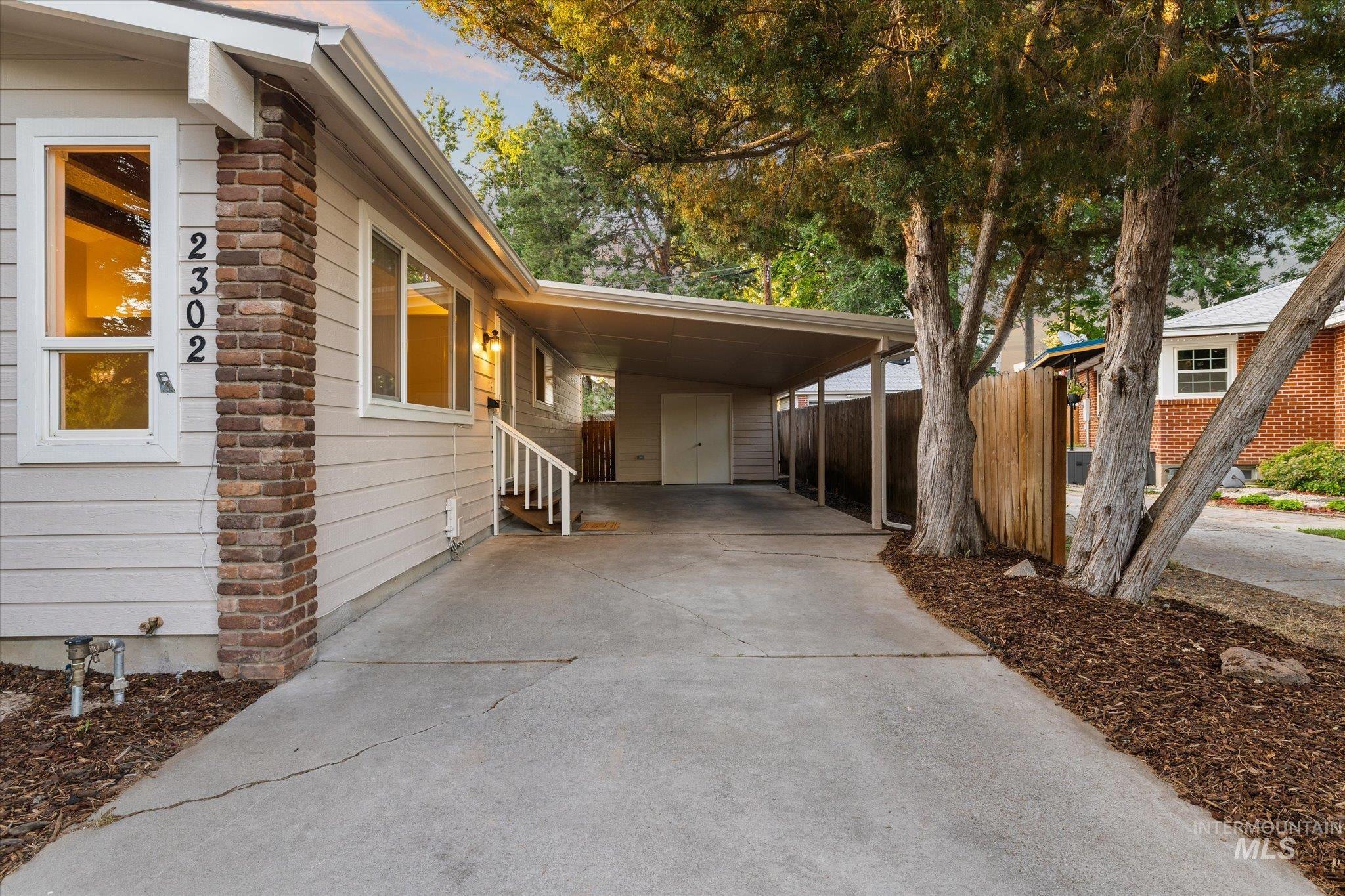 2302 Pendleton Street Boise, ID 83705 - Photo 2 of 35 Carport with a concrete driveway and an attached storage shed