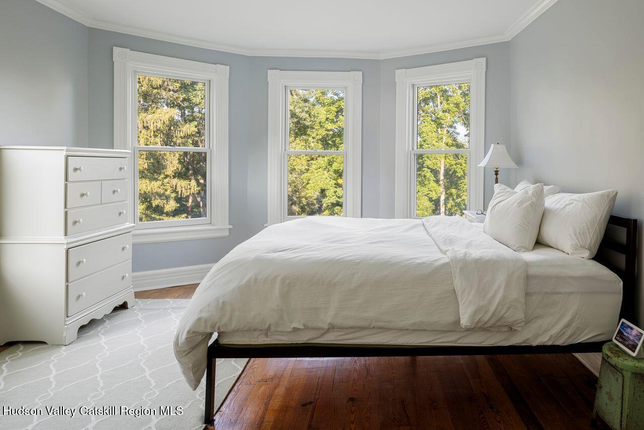 276 Leeds Athens Road Athens, NY 12015 - Photo 12 of 27 a large bed sitting in a bedroom next to a window