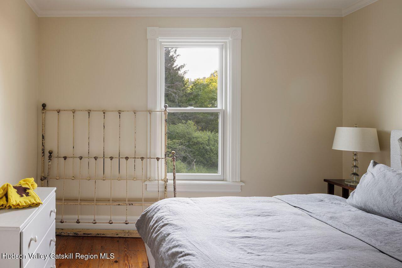 276 Leeds Athens Road Athens, NY 12015 - Photo 14 of 27 a bedroom with a bed and a window