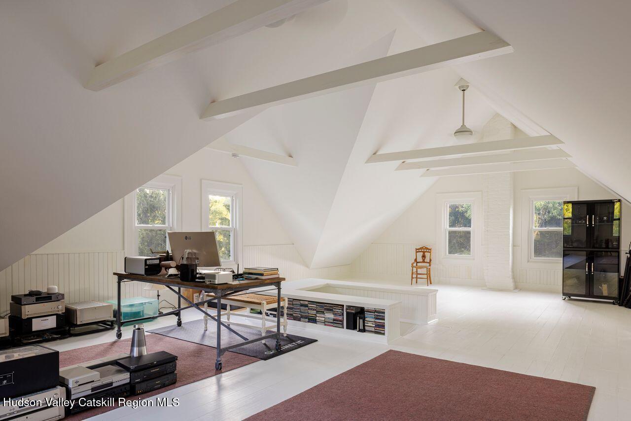276 Leeds Athens Road Athens, NY 12015 - Photo 19 of 27 a living room with furniture a clock and a large window