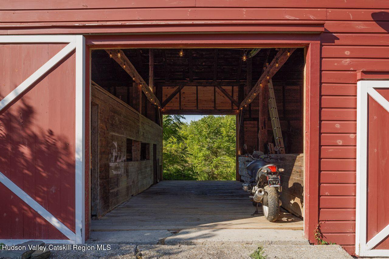 276 Leeds Athens Road Athens, NY 12015 - Photo 22 of 27 a view of a porch with furniture and floor to ceiling window