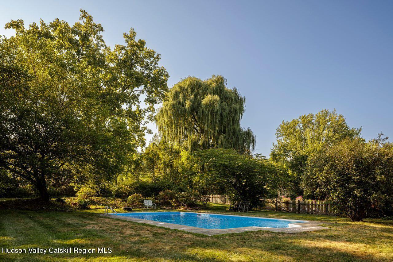 276 Leeds Athens Road Athens, NY 12015 - Photo 23 of 27 a view of a swimming pool and trees in the background