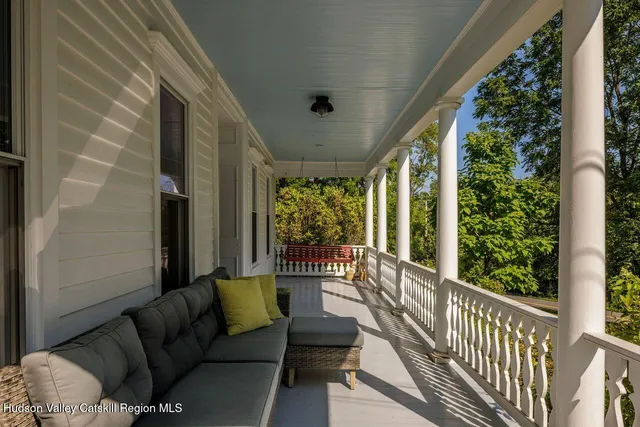 a view of balcony with furniture