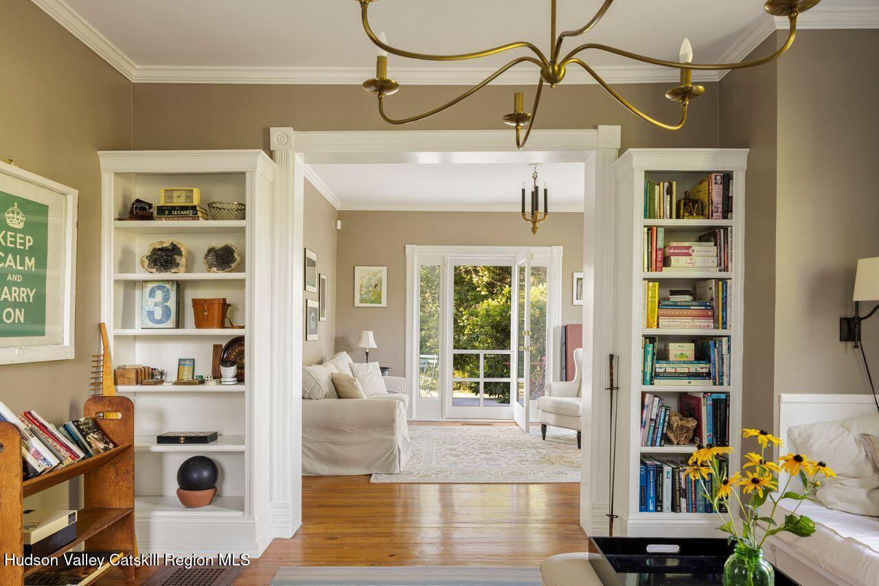 276 Leeds Athens Road Athens, NY 12015 - Photo 8 of 27 a living room with furniture and a book shelf
