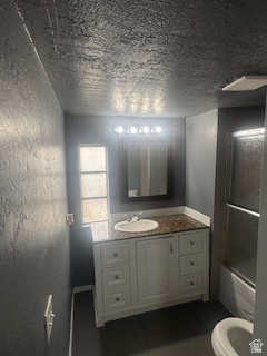 8155 South Redwood Road, Unit 96 West Jordan, UT 84088 - Photo 12 of 17 Full bath featuring vanity, shower / tub combination, and dark tile patterned flooring