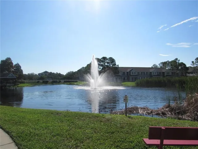 a view of a lake with houses in the back
