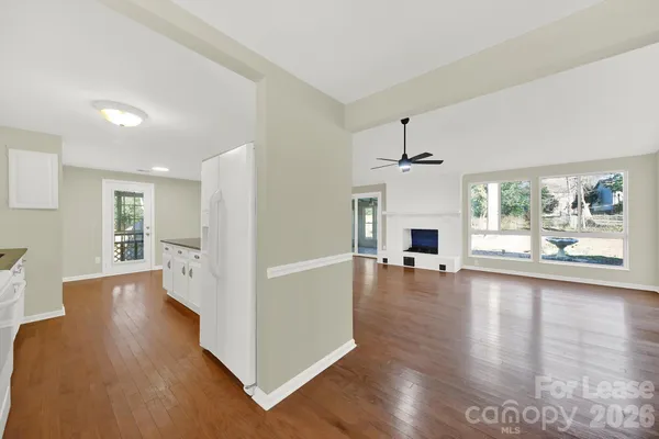 a view of a living room and a fireplace