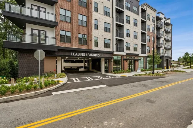 a view of a brick building with many windows