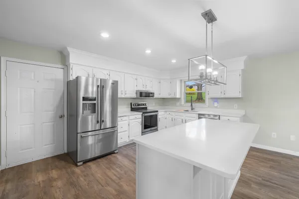 a kitchen with a sink and window