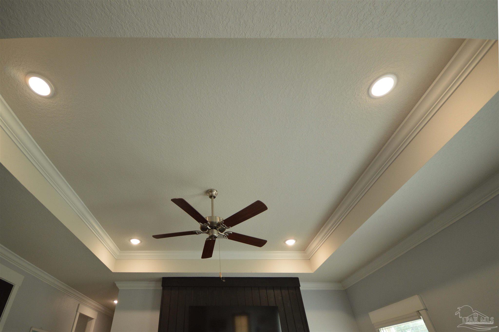 4453 Jude Way Pace, FL 32571 - Photo 11 of 41 a living room with a ceiling fan and a wooden floor