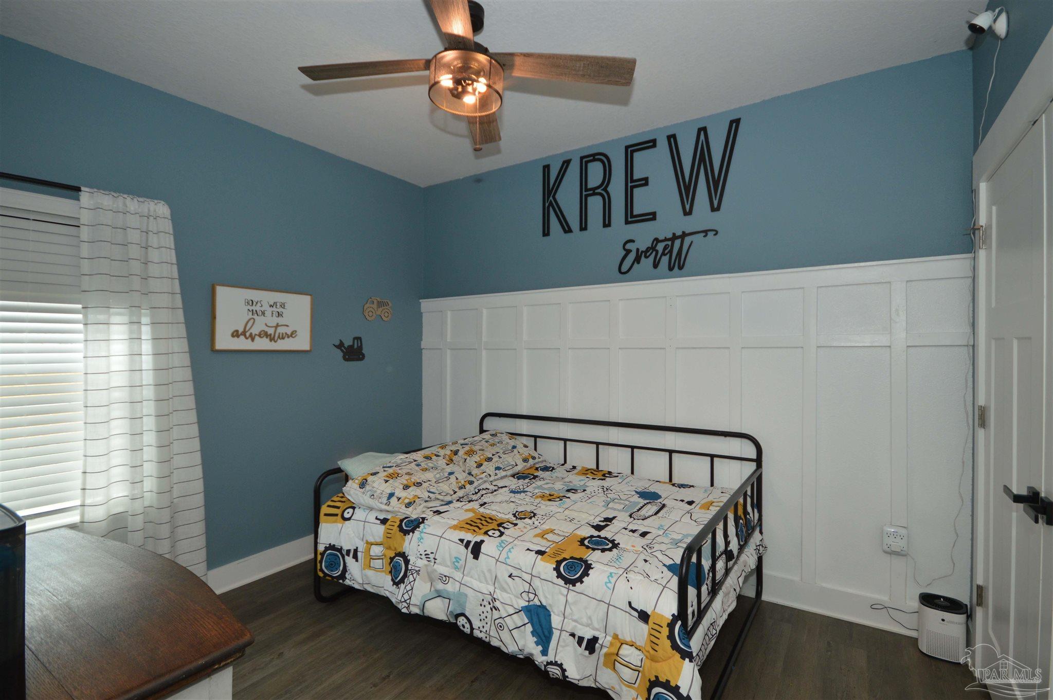 4453 Jude Way Pace, FL 32571 - Photo 29 of 41 a bedroom with a bed and a window