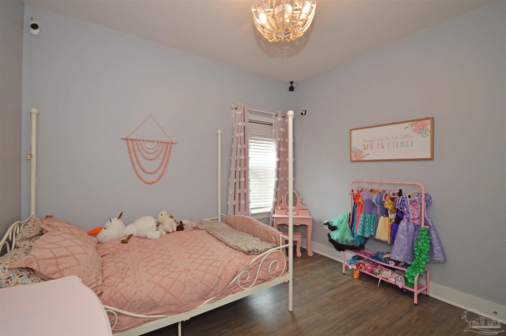 4453 Jude Way Pace, FL 32571 - Photo 30 of 41 a bedroom with a bed and window