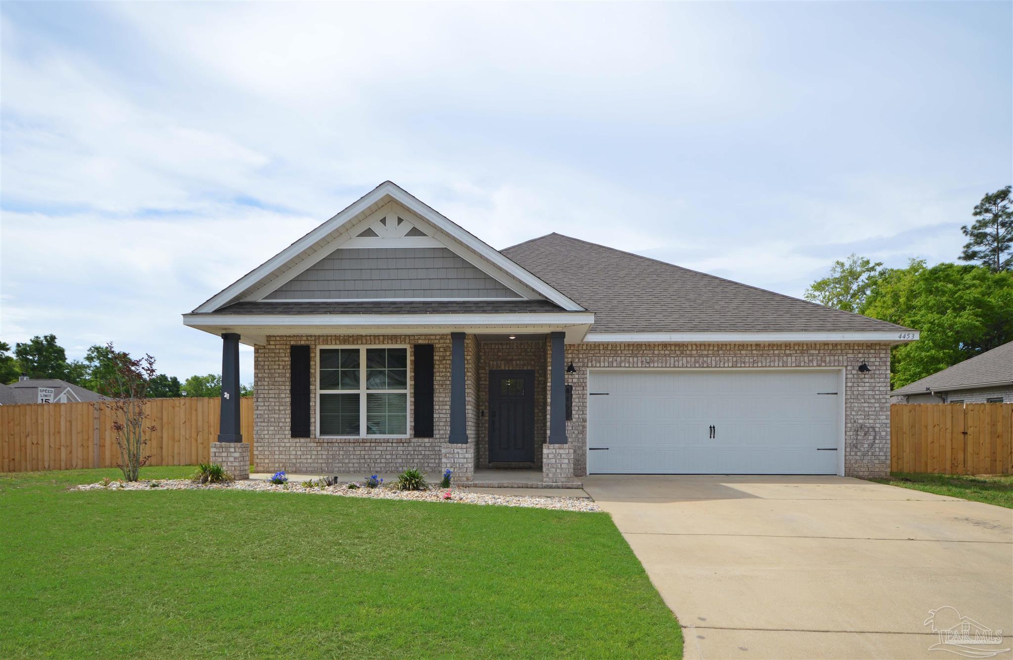 4453 Jude Way Pace, FL 32571 - Photo 3 of 41 front view of a house with a yard and a garage
