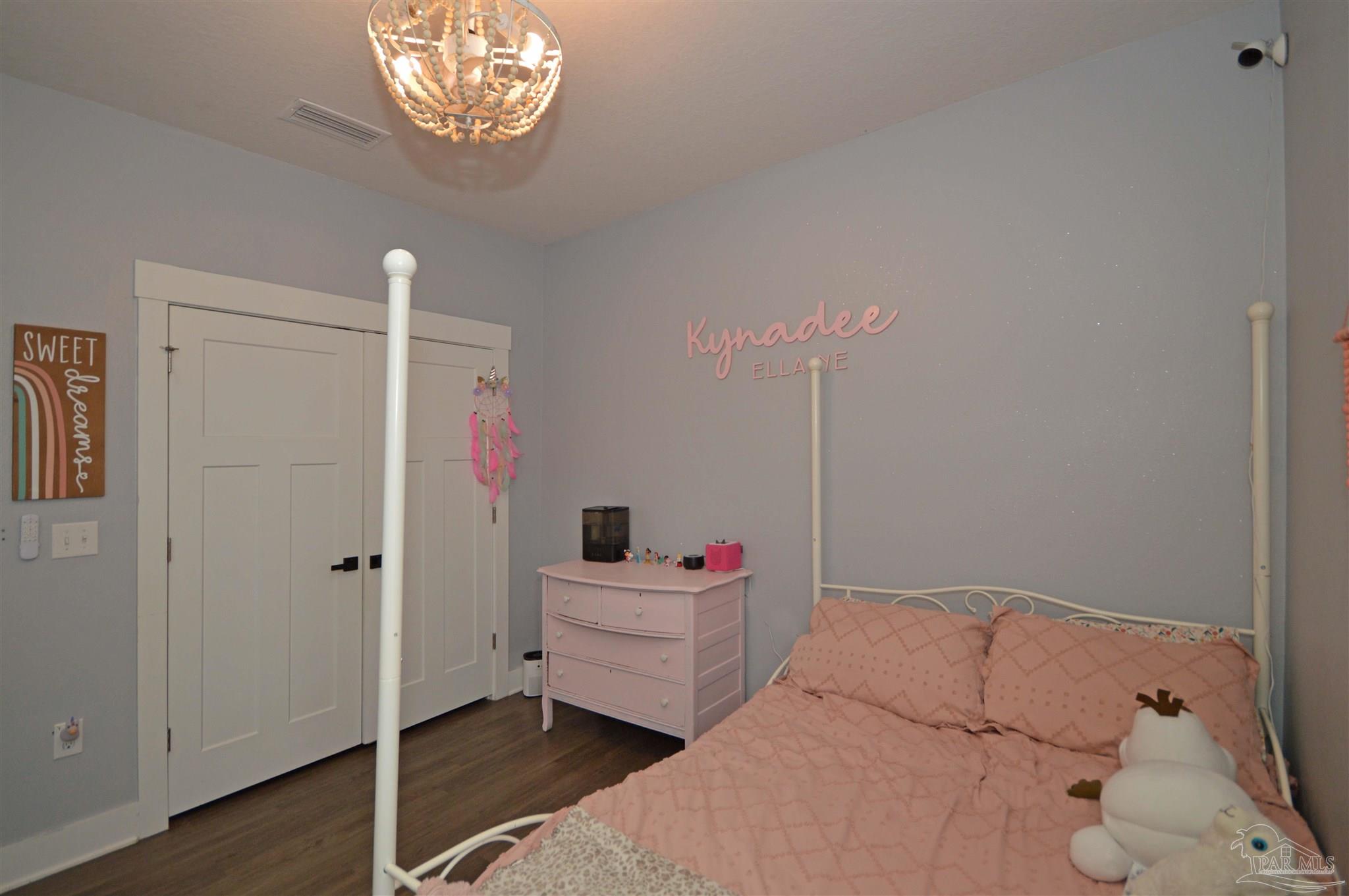 4453 Jude Way Pace, FL 32571 - Photo 31 of 41 a en suite bathroom with a sink and a mirror