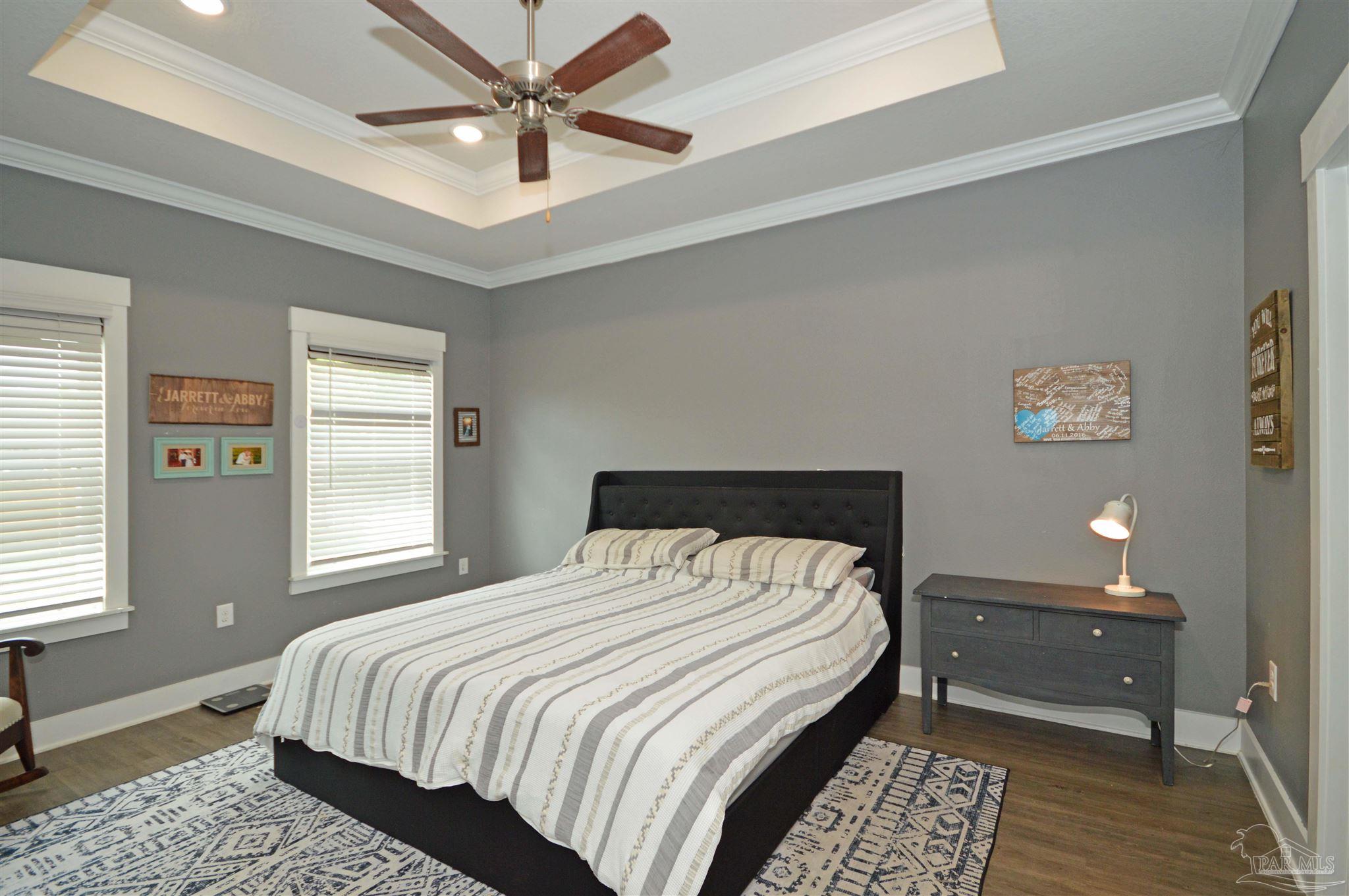 4453 Jude Way Pace, FL 32571 - Photo 36 of 41 a bedroom with a bed and a window