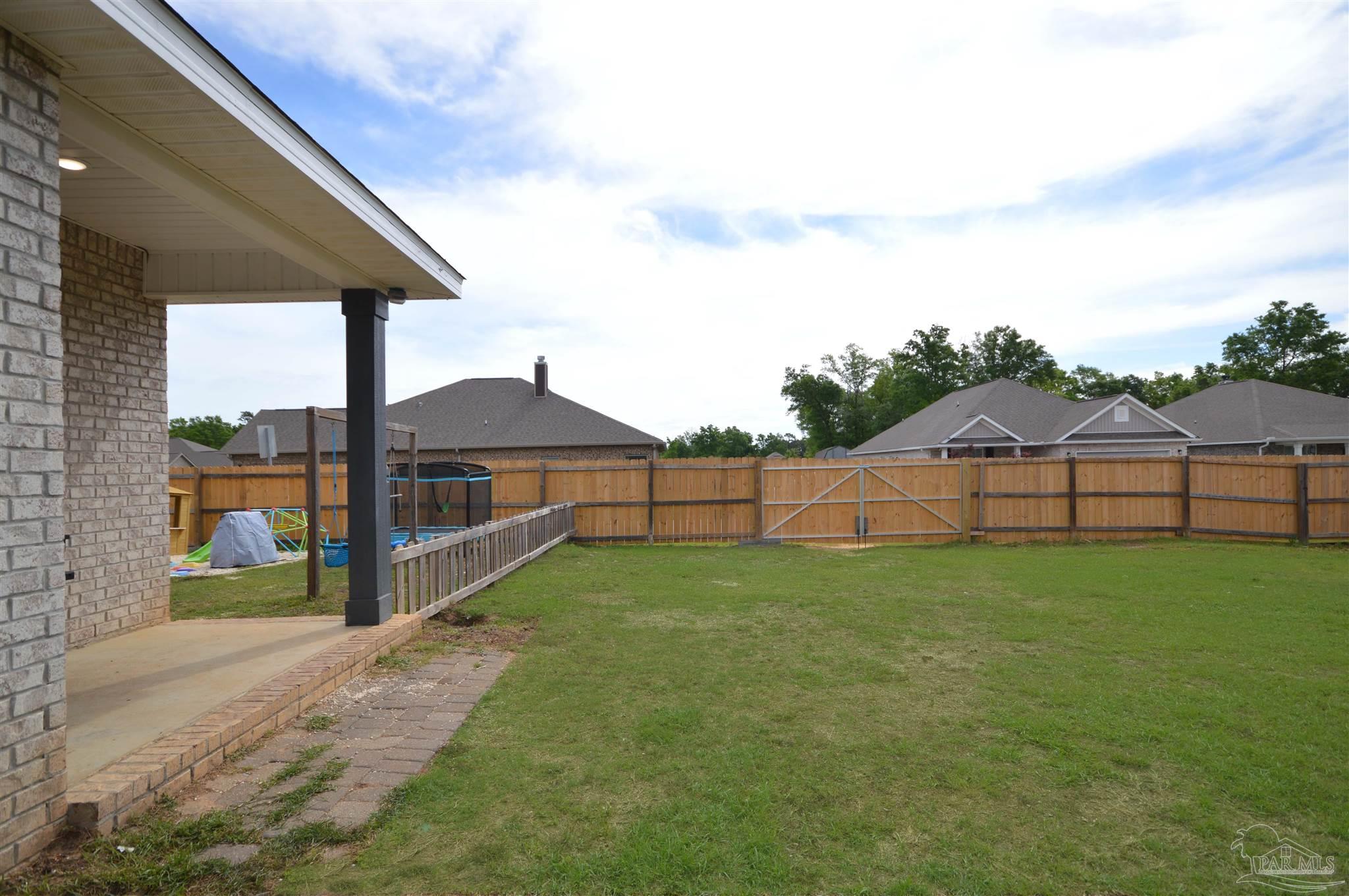 4453 Jude Way Pace, FL 32571 - Photo 37 of 41 a view of backyard with green space