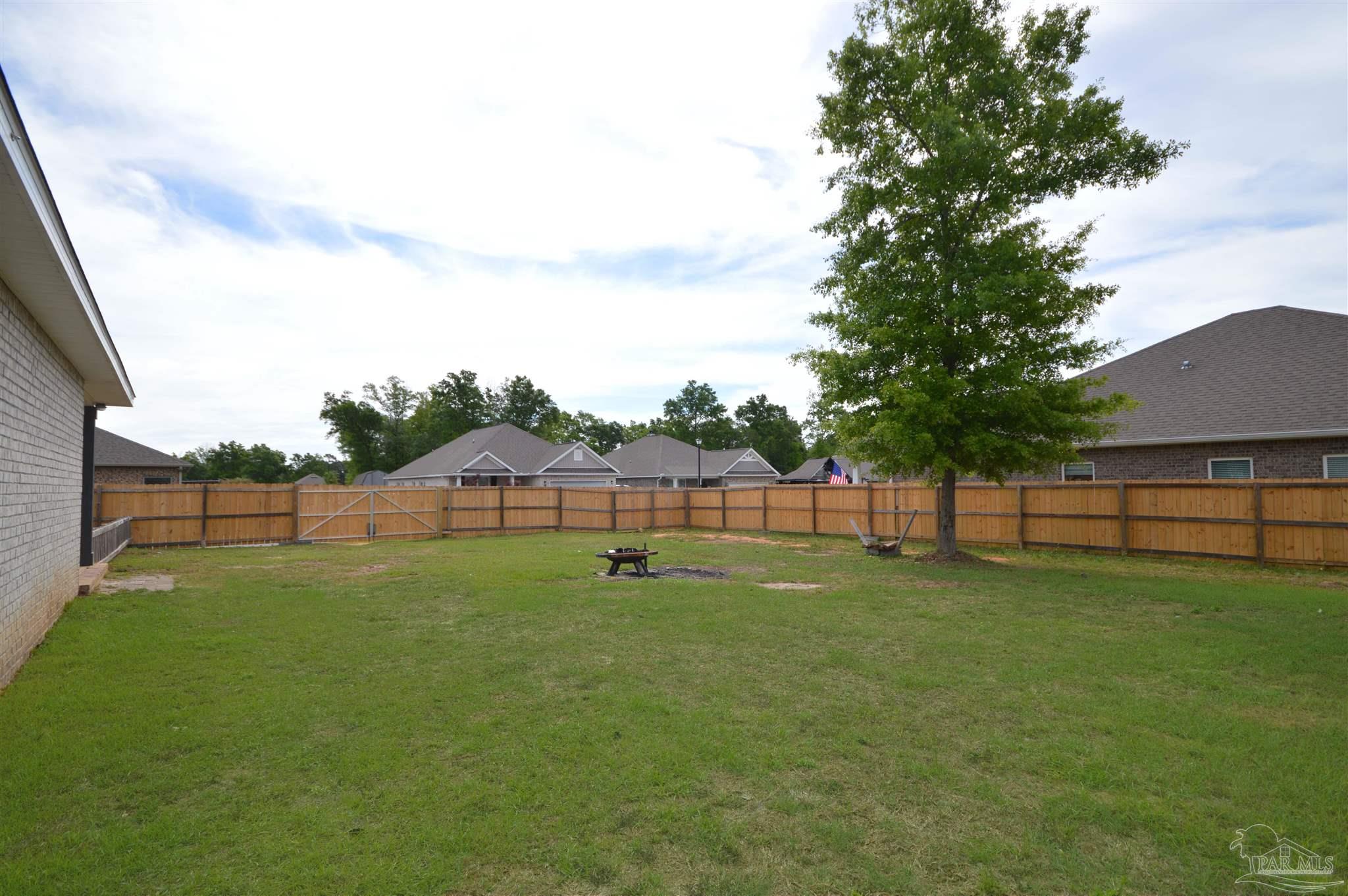4453 Jude Way Pace, FL 32571 - Photo 38 of 41 a view of a backyard of a house
