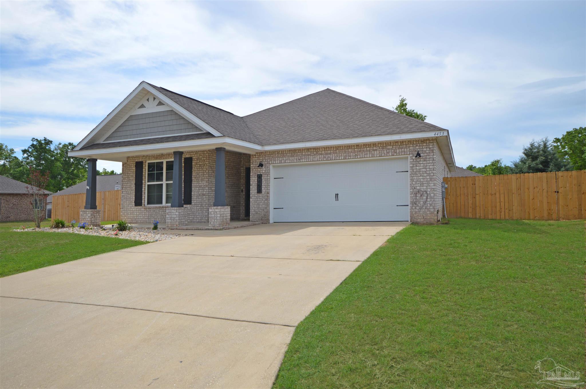 4453 Jude Way Pace, FL 32571 - Photo 4 of 41 front view of house with a yard
