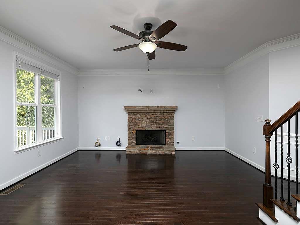 821 Tramore Road Acworth, GA 30102 - Photo 15 of 36 a living room with a fireplace and a window