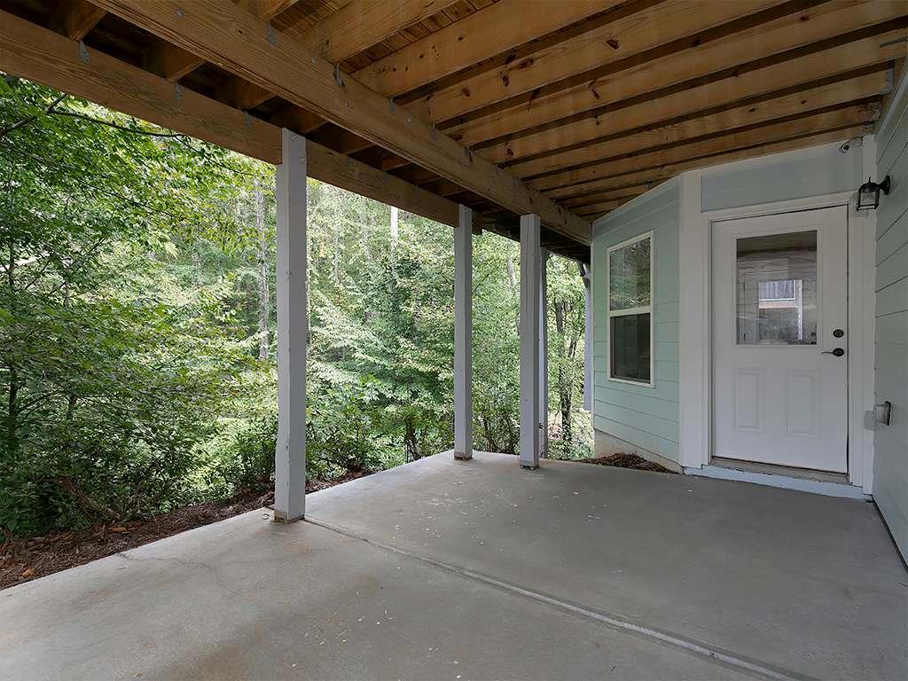 821 Tramore Road Acworth, GA 30102 - Photo 33 of 36 a view of a room with wooden floor and roof
