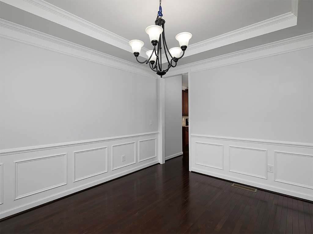 821 Tramore Road Acworth, GA 30102 - Photo 6 of 36 a view of an empty room with wooden floor