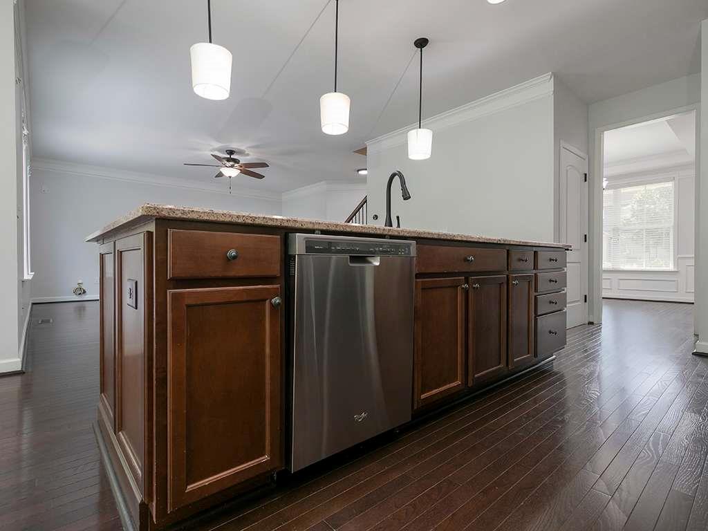 821 Tramore Road Acworth, GA 30102 - Photo 8 of 36 a view of a hallway with wooden floor and staircase