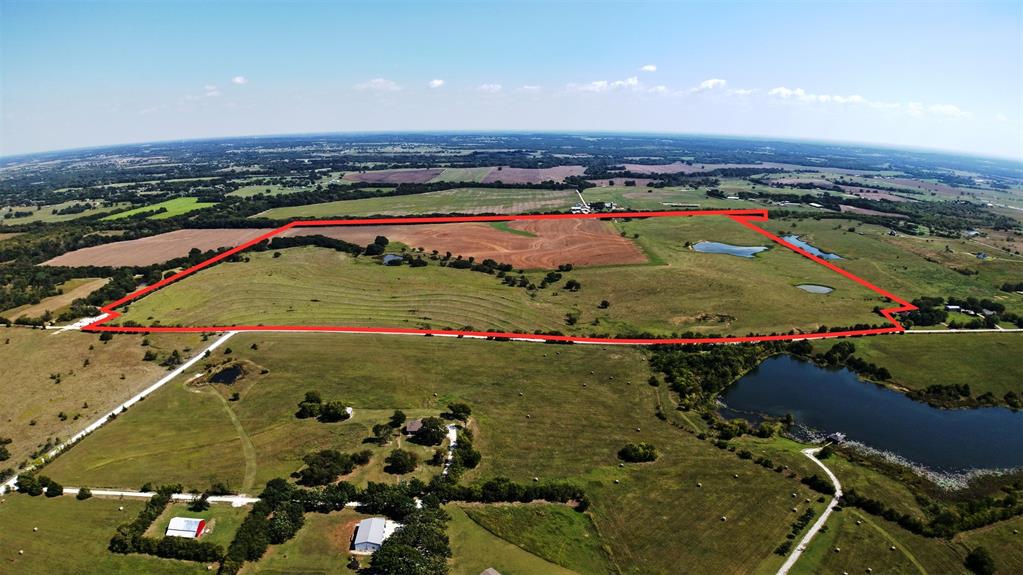 1131 Old Denton Road Gainesville, TX 76240 - Photo 9 of 9 an aerial view of a pool and a yard