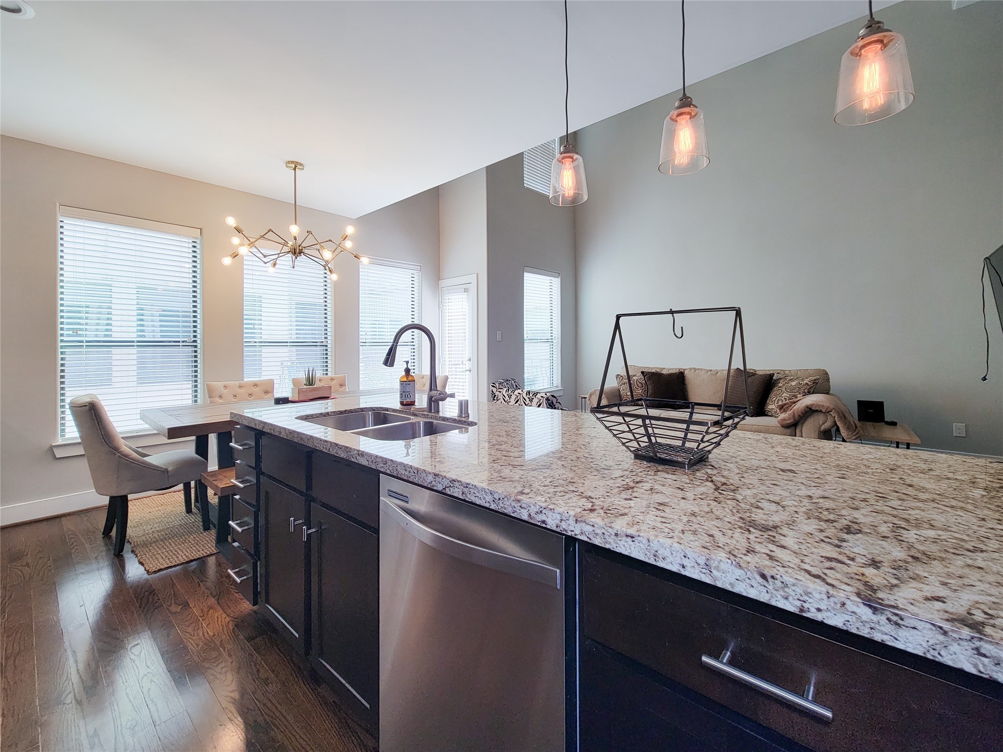 1424 Wilson Street Houston, TX 77019 - Photo 17 of 47 a kitchen with kitchen island granite countertop a sink cabinets and wooden floor