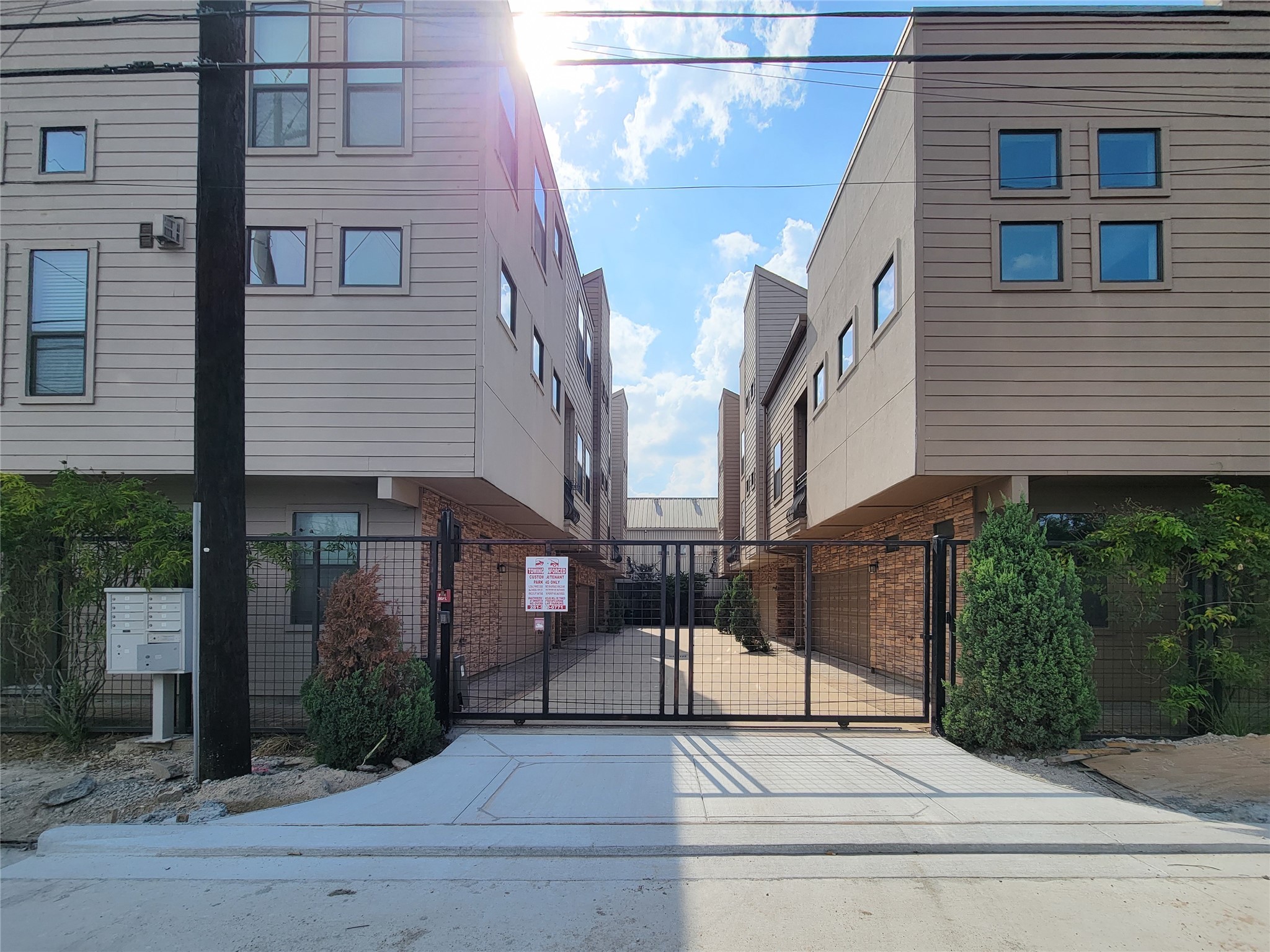 1424 Wilson Street Houston, TX 77019 - Photo 3 of 47 a view of a brick house with plants and wooden fence