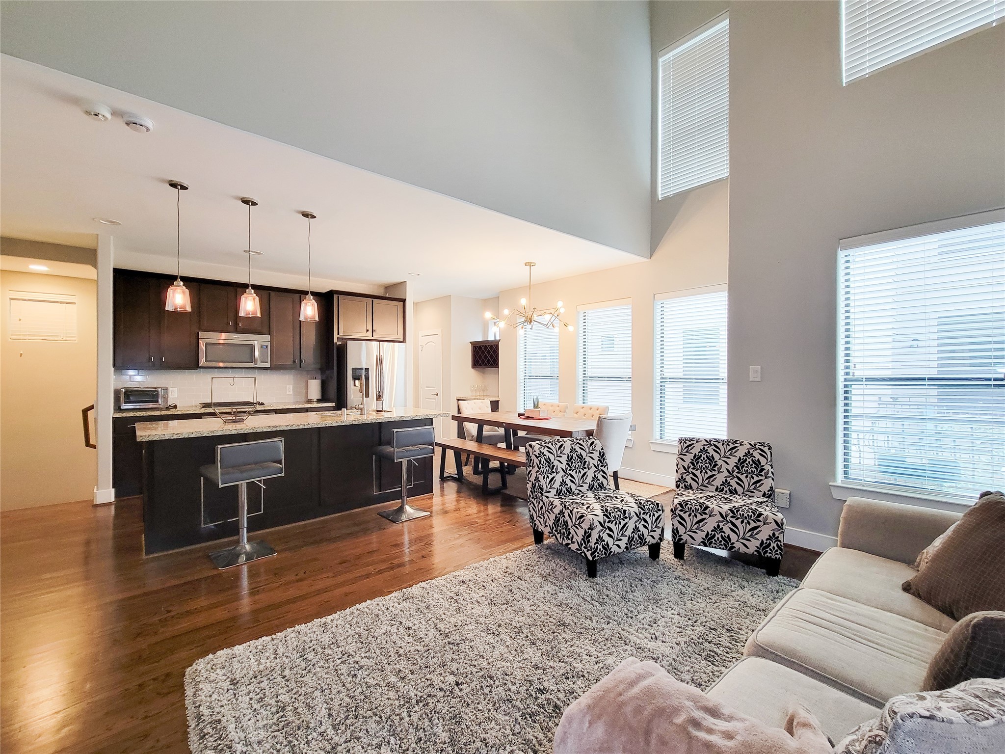 1424 Wilson Street Houston, TX 77019 - Photo 32 of 47 a living room with furniture kitchen view and large windows