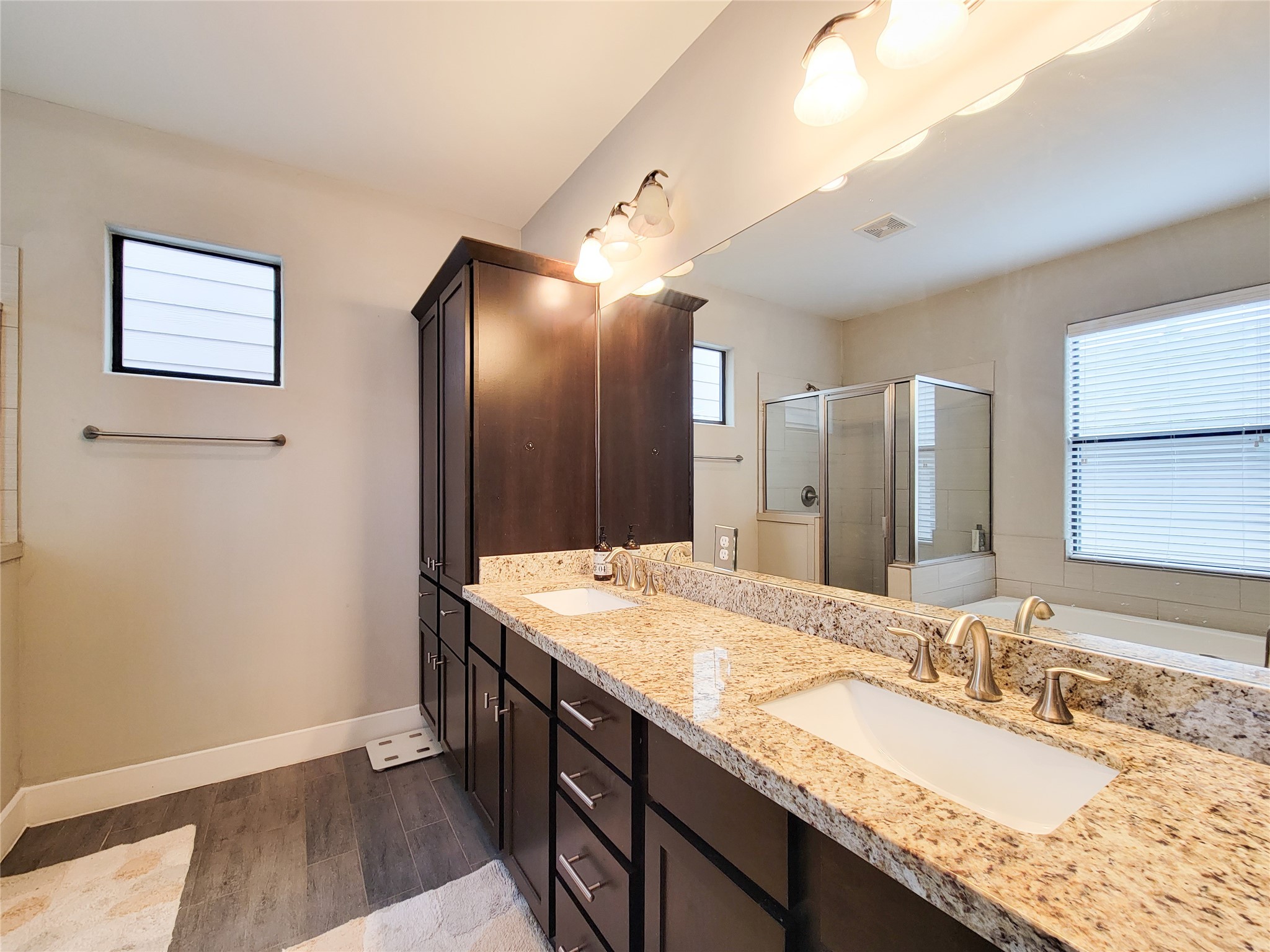 1424 Wilson Street Houston, TX 77019 - Photo 37 of 47 a bathroom with a granite countertop double vanity sink and a mirror