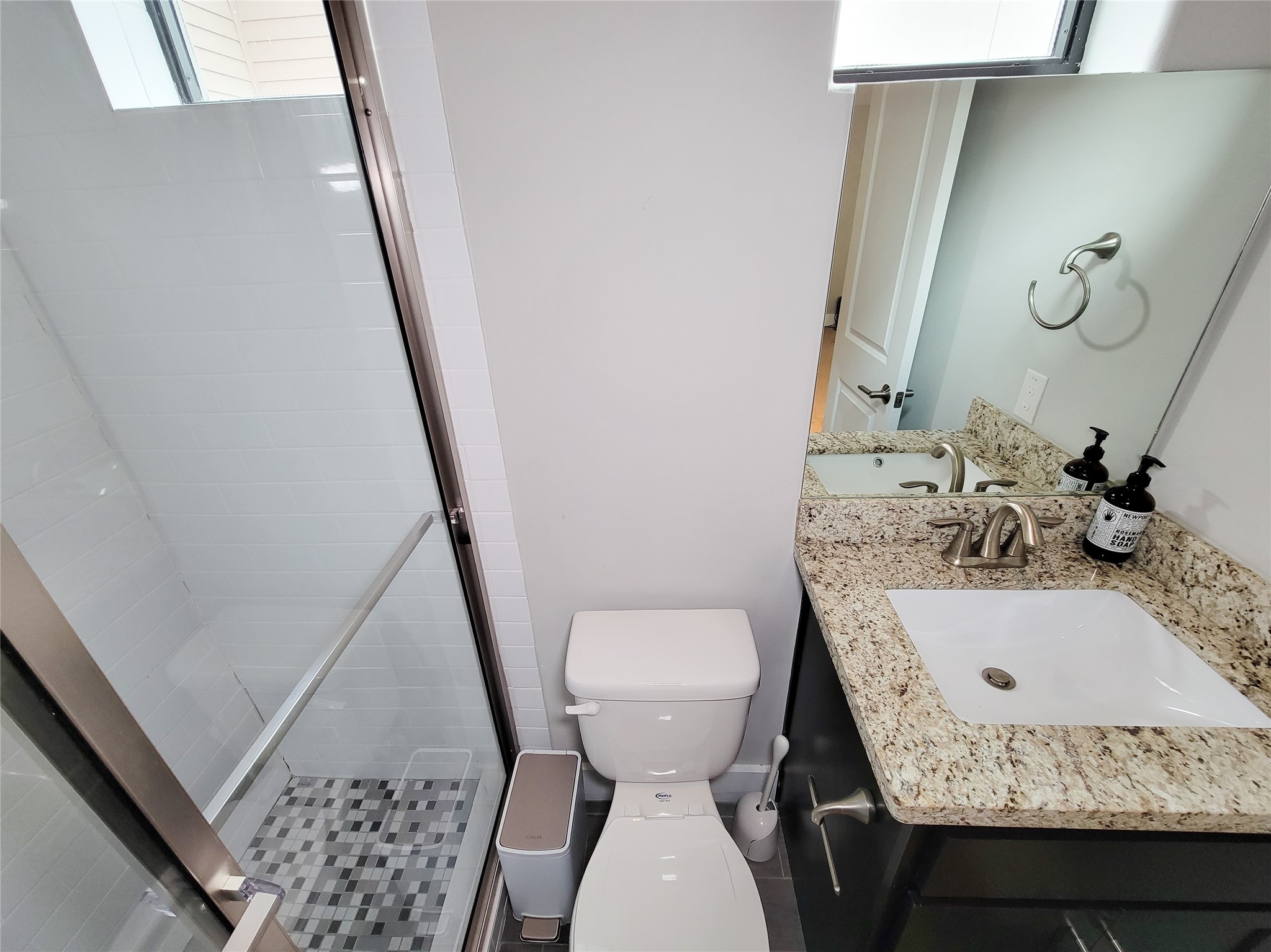 1424 Wilson Street Houston, TX 77019 - Photo 41 of 47 a bathroom with a sink a toilet and a mirror